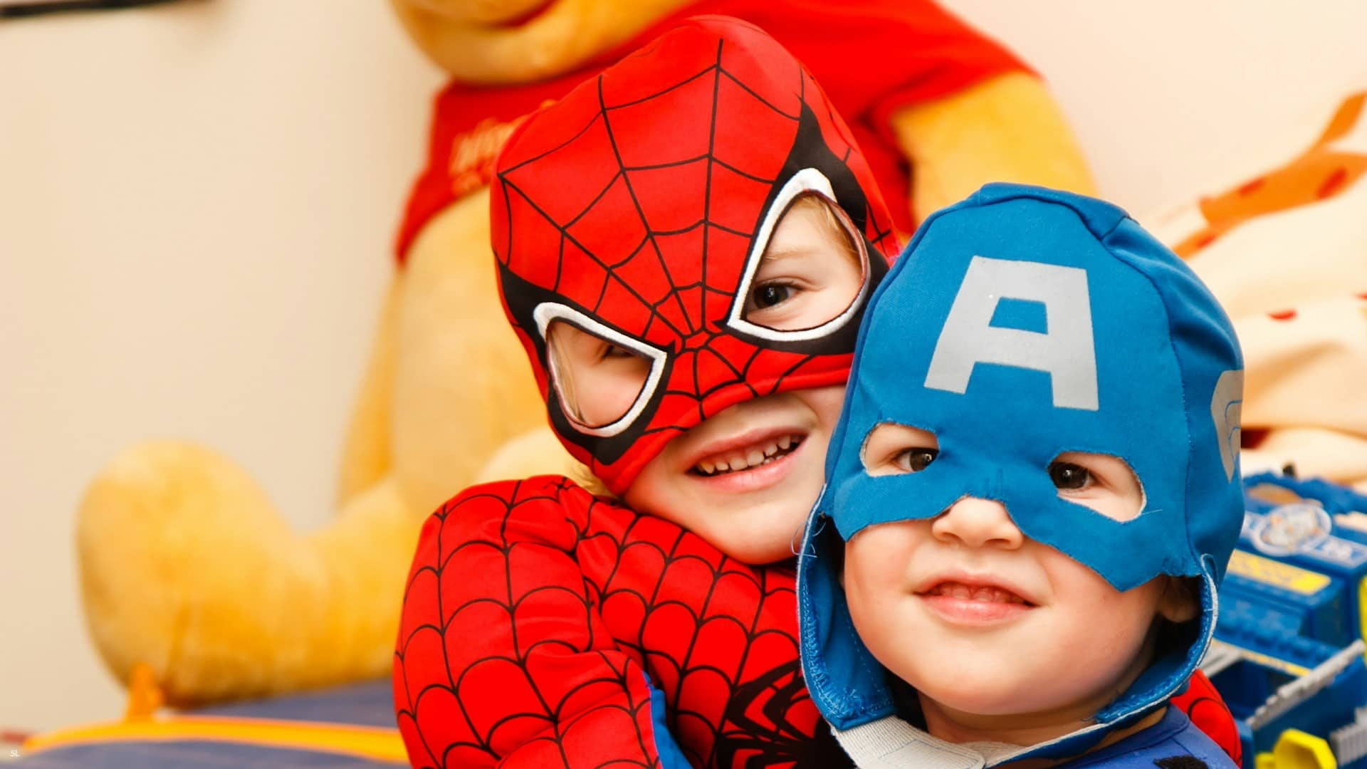 Kids playing in spiderman suit